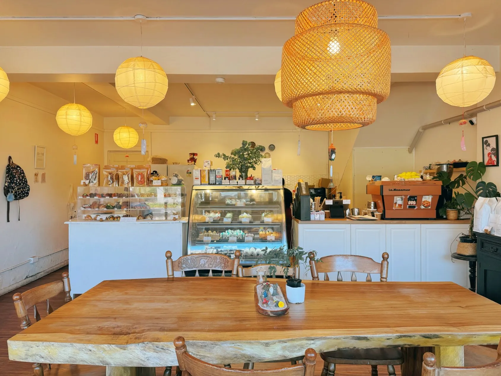 Cake cabinet and coffee counter under lanterns